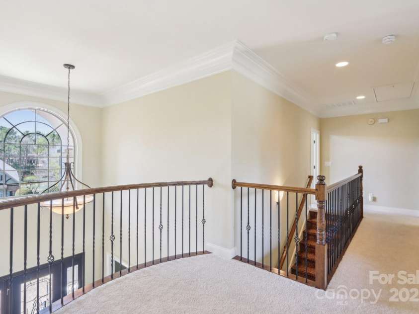 1322 Shinnecock Lane, Fort Mill, SC 29707.  MLS# CAR4239031, YatesRealty ID 4879. 2nd floor landing with Juliete balcony w/ iron balusters.