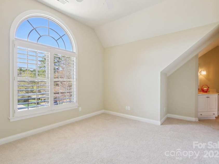 1322 Shinnecock Lane, Fort Mill, SC 29707.  MLS# CAR4239031, YatesRealty ID 4879. Bedroom 4 with vaulted ceiling, fan, walk in closet & palladium window.