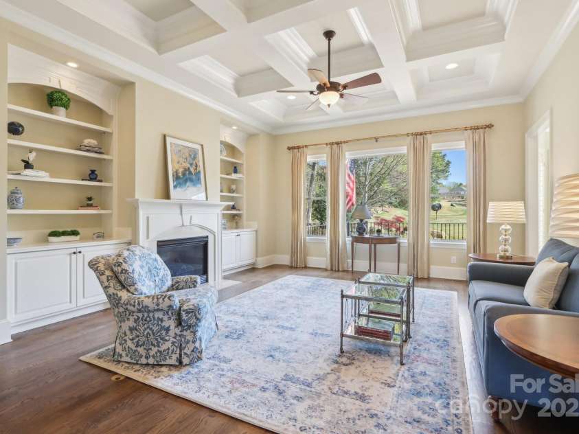 1322 Shinnecock Lane, Fort Mill, SC 29707.  MLS# CAR4239031, YatesRealty ID 4879. Coffered ceiling w/ recessed lighting, built in cabinets & shelving, gas fireplace & hardwood floors.