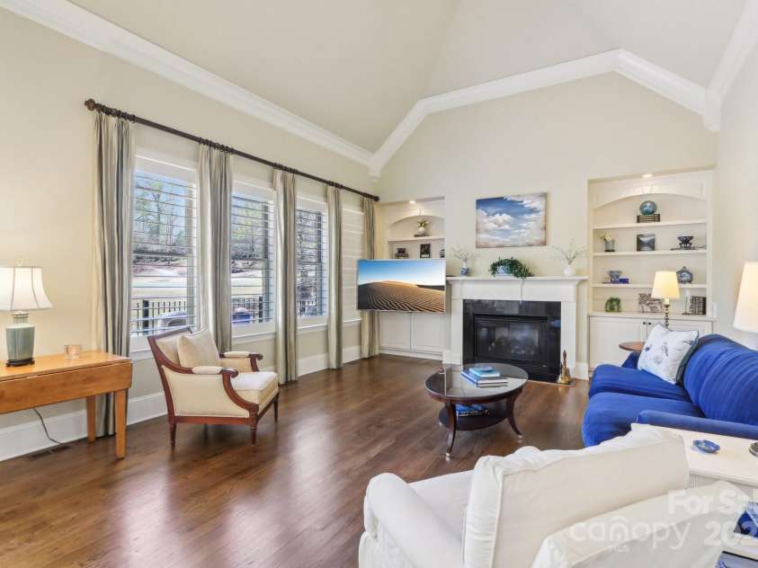 1322 Shinnecock Lane, Fort Mill, SC 29707.  MLS# CAR4239031, YatesRealty ID 4879. Great room w/ soaring ceilings, built-in bookcases & shelving, gas fireplace, surround sound, swivel mount tv, fan & ultra clear 4 1/2