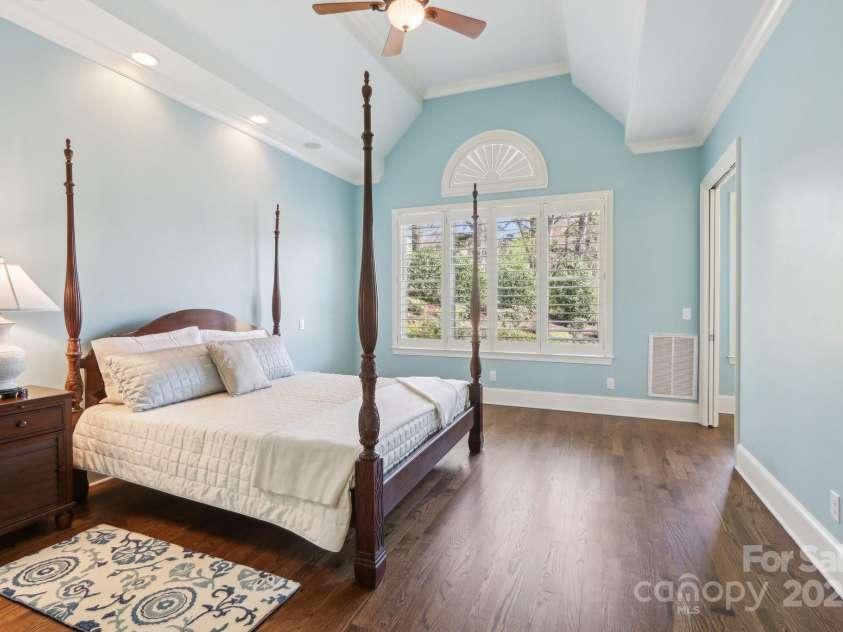 1322 Shinnecock Lane, Fort Mill, SC 29707.  MLS# CAR4239031, YatesRealty ID 4879. Primary bedroom w/ tray ceiling, recessed lights, fan, surround sound, wall sconces, sitting room, 2 walk in closets & ensuite bath.