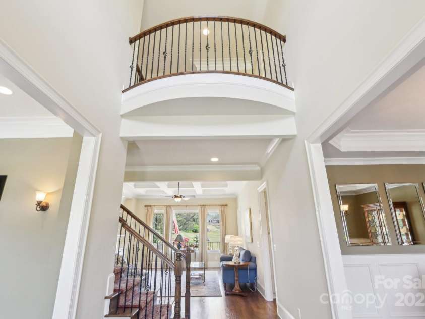 1322 Shinnecock Lane, Fort Mill, SC 29707.  MLS# CAR4239031, YatesRealty ID 4879. Two story foyer with juliete balcony flanked with formal dining and office.