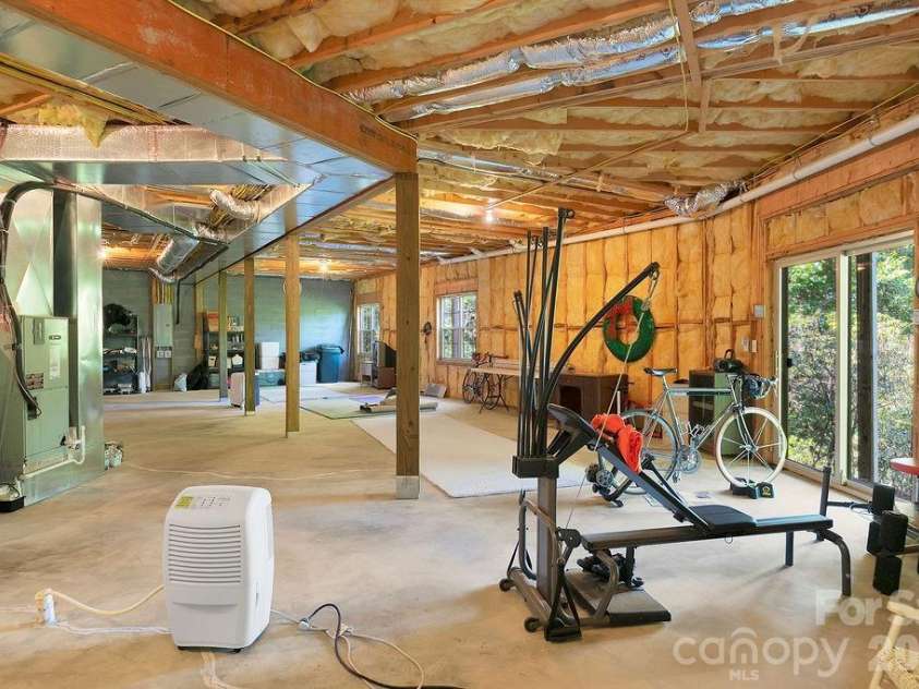 1228 Ugugu Drive, Brevard, NC 28712.  MLS# CAR4413645, YatesRealty ID 48800. Basement with tall ceilings
