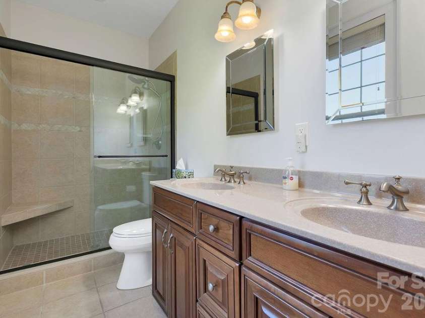 1228 Ugugu Drive, Brevard, NC 28712.  MLS# CAR4413645, YatesRealty ID 48800. Primary bath 2