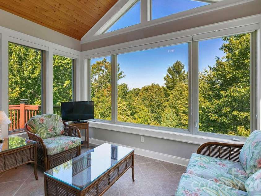 1228 Ugugu Drive, Brevard, NC 28712.  MLS# CAR4413645, YatesRealty ID 48800. Sunroom