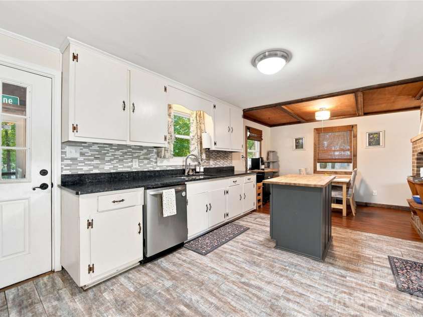7704 Otts Circle, Stanley, NC 28164.  MLS# CAR4421199, YatesRealty ID 48801. Kitchen w/access to back porch & yard