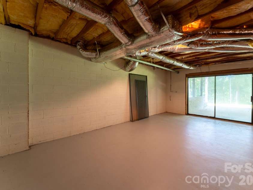 1886 Tanasee Gap Road, Balsam Grove, NC 28708.  MLS# CAR4421630, YatesRealty ID 48802. Down to the basement.