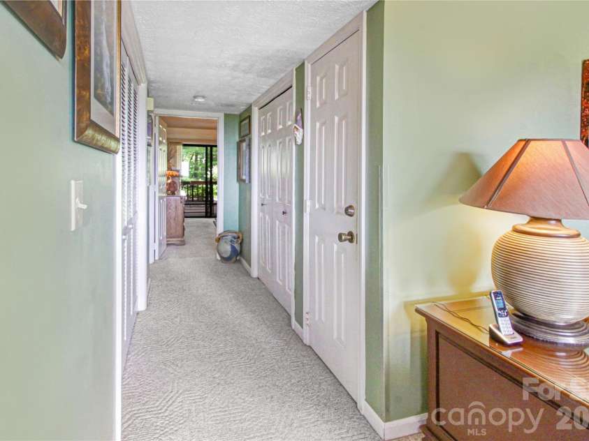 97 Toxaway Views Drive, Lake Toxaway, NC 28747.  MLS# CAR4421561, YatesRealty ID 48805. Laundry in hall