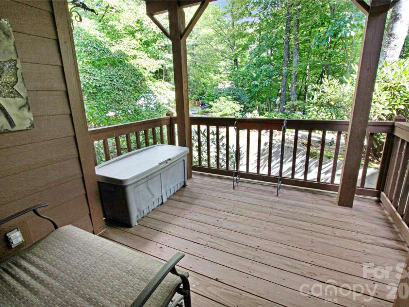 97 Toxaway Views Drive, Lake Toxaway, NC 28747.  MLS# CAR4421561, YatesRealty ID 48805. Private deck off the Primary Suite