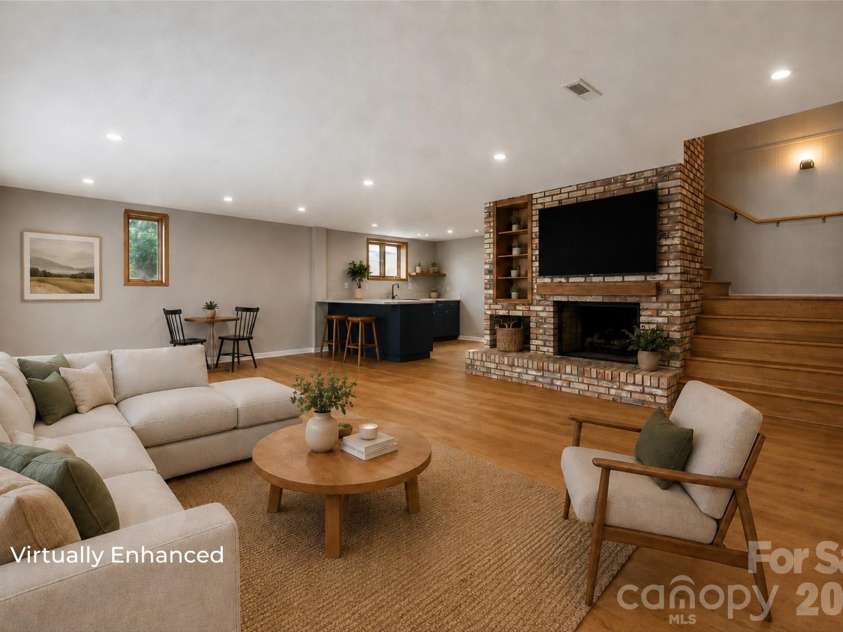 131 Baywatch Drive, Mooresville, NC 28117.  MLS# CAR4420132, YatesRealty ID 48806. Virtually enhanced basement living area with fireplace