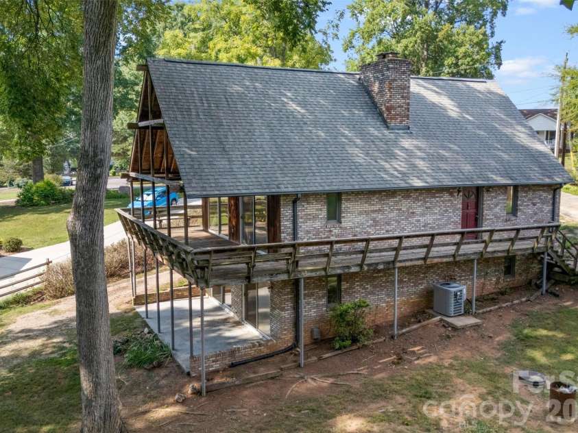 131 Baywatch Drive, Mooresville, NC 28117.  MLS# CAR4420132, YatesRealty ID 48806. Wrap around deck and basement walkout access.
