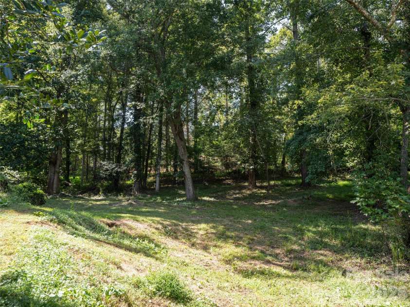 26 Audrey Lane, Asheville, NC 28806.  MLS# CAR4421510, YatesRealty ID 48827. Tree filled back yard