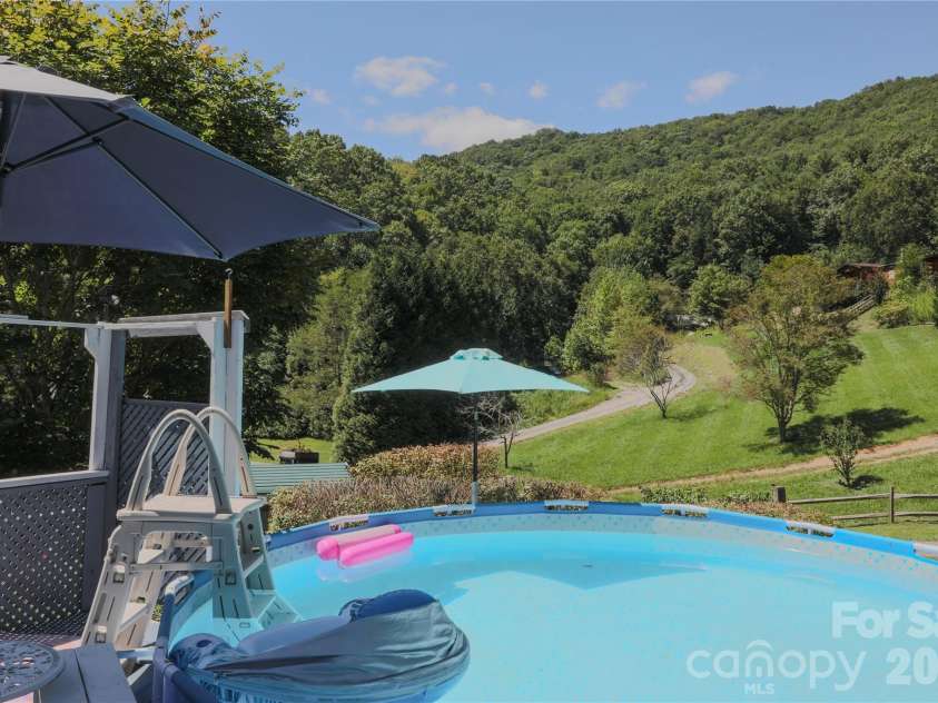 76 Patriot Drive, Waynesville, NC 28786.  MLS# CAR4418358, YatesRealty ID 48836. Pool relaxation