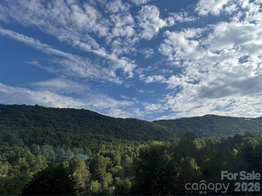76 Patriot Drive, Waynesville, NC 28786.  MLS# CAR4418358, YatesRealty ID 48836. View from rear deck at 5pm