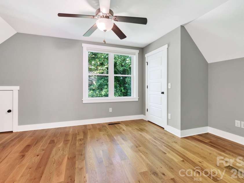 32 Florida Avenue, Asheville, NC 28806.  MLS# CAR4421230, YatesRealty ID 48838. Second-Level Bedroom with Desk Nook and Attic Storage