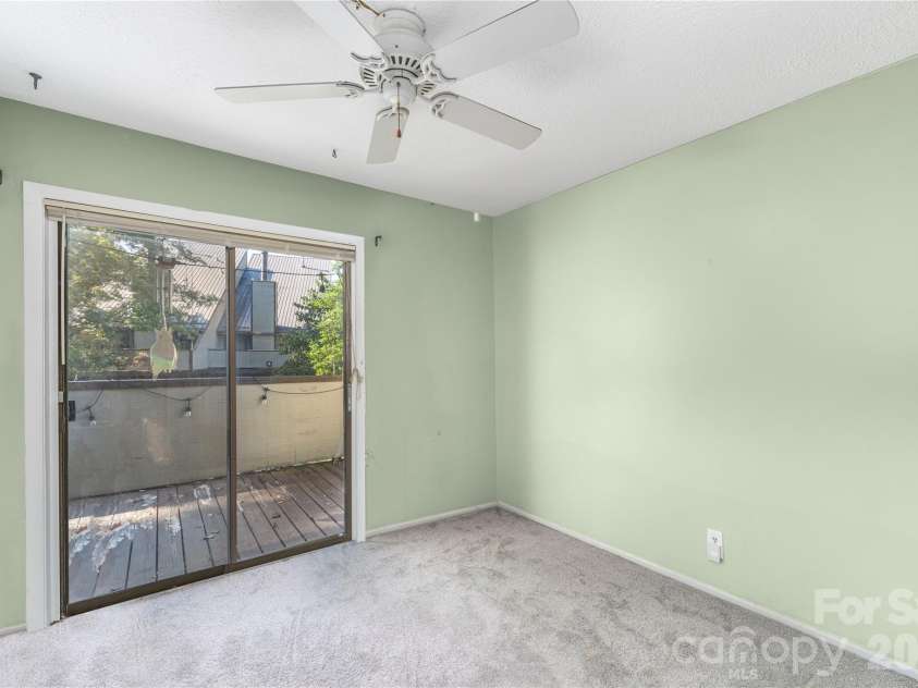 11 Maple Ridge Lane, Asheville, NC 28806.  MLS# CAR4420980, YatesRealty ID 48845. Both bedrooms have sliding doors to covered deck.