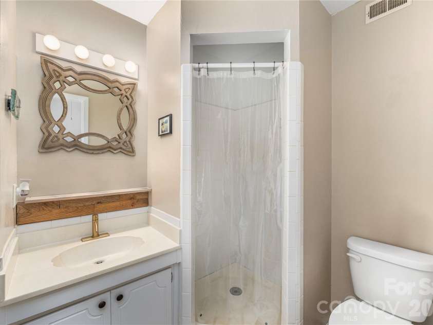 11 Maple Ridge Lane, Asheville, NC 28806.  MLS# CAR4420980, YatesRealty ID 48845. Master bath with walk in shower.