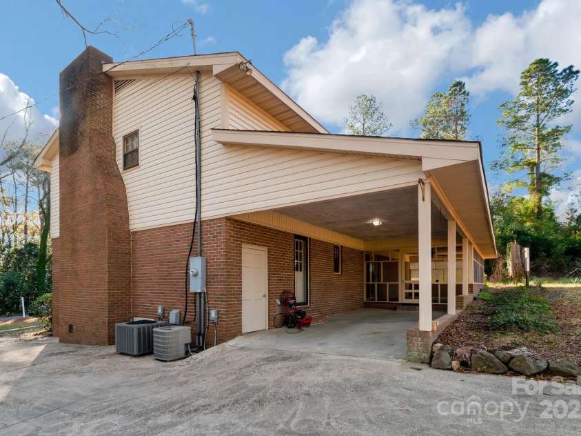 407 Covington Street, Rockingham, NC 28379.  MLS# CAR4237436, YatesRealty ID 4885. Drive way side of home