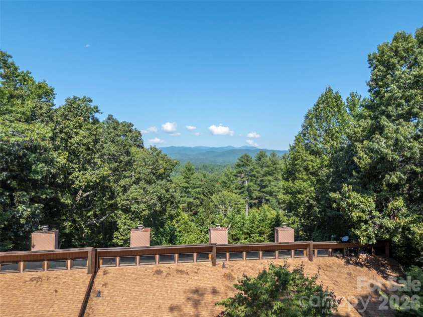 58 Timbertop Lane, Etowah, NC 28729.  MLS# CAR4421699, YatesRealty ID 48857. Aerial view of mountains