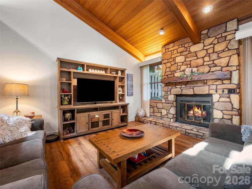 58 Timbertop Lane, Etowah, NC 28729.  MLS# CAR4421699, YatesRealty ID 48857. Living Room with Fireplace (added flame as example)