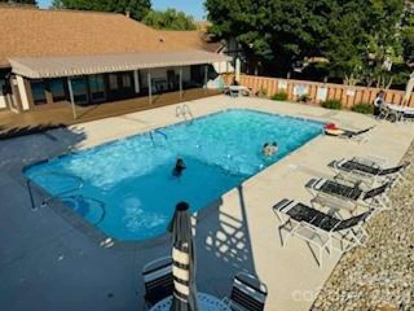 1403 Fleetwood Plaza, Hendersonville, NC 28739.  MLS# CAR4332853, YatesRealty ID 4886. Private Pool directly beside this specific condo.  