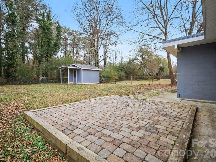 112 Lineberger Street, Stanley, NC 28164.  MLS# CAR4340100, YatesRealty ID 4887. Back Patio, Yard & storage Shed