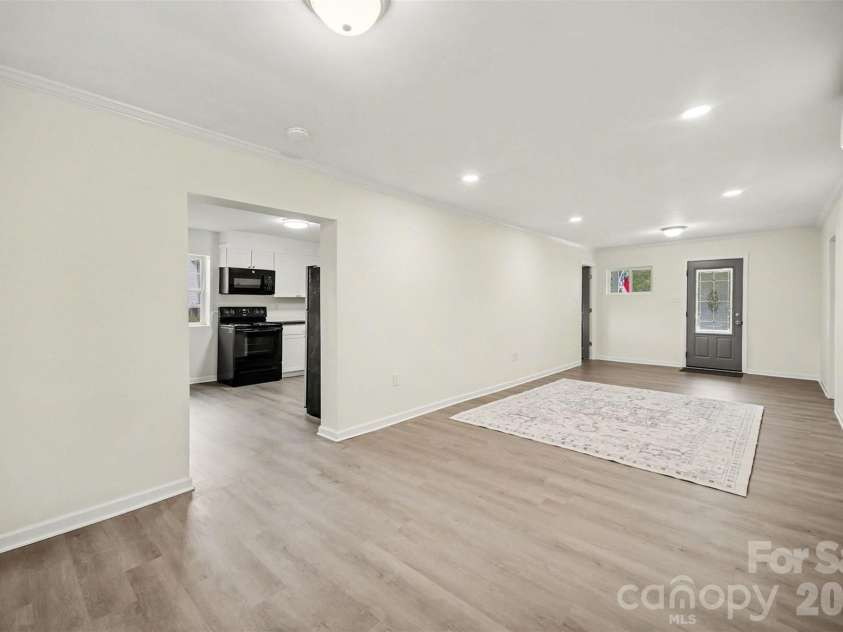 112 Lineberger Street, Stanley, NC 28164.  MLS# CAR4340100, YatesRealty ID 4887. Living Room into Kitchen