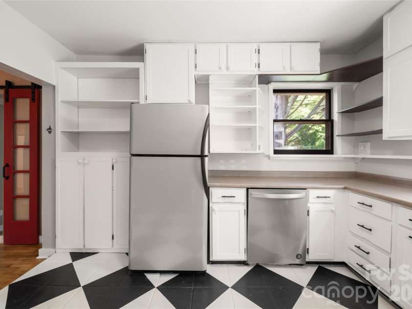 101 Olney Road, Asheville, NC 28806.  MLS# CAR4421259, YatesRealty ID 48879. Massive storage with multiple large cabinets and open shelving