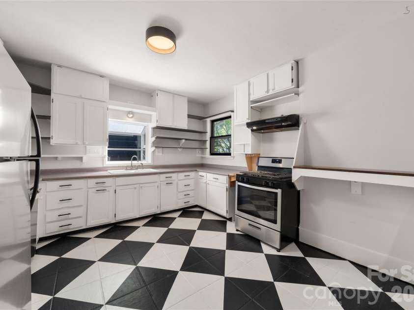 101 Olney Road, Asheville, NC 28806.  MLS# CAR4421259, YatesRealty ID 48879. Such a bright, happy kitchen flooded with light from three windows