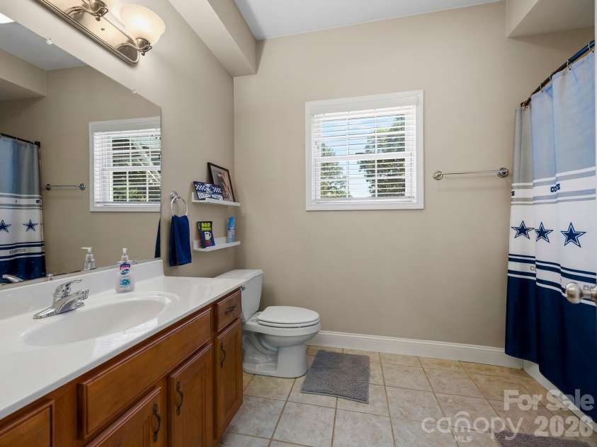 66 Azalea Drive, Weaverville, NC 28787.  MLS# CAR4421280, YatesRealty ID 48881. Full lower bathroom