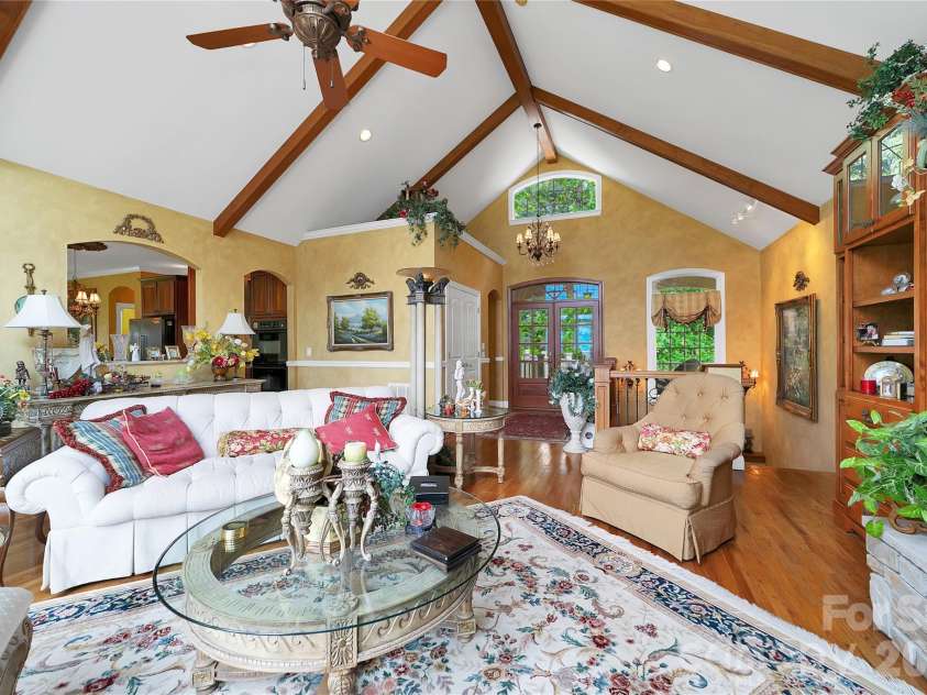 303 Wodigeasgohi Drive, Brevard, NC 28712.  MLS# CAR4419106, YatesRealty ID 48899. Great room facing entry