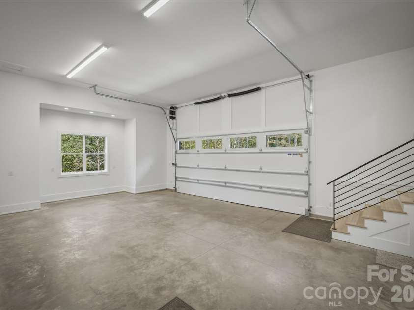 2303 Paddock Circle, Morganton, NC 28655.  MLS# CAR4416605, YatesRealty ID 48902. Finally, here is the inside of the oversized 2 car garage which has an epoxy flake garage floor.