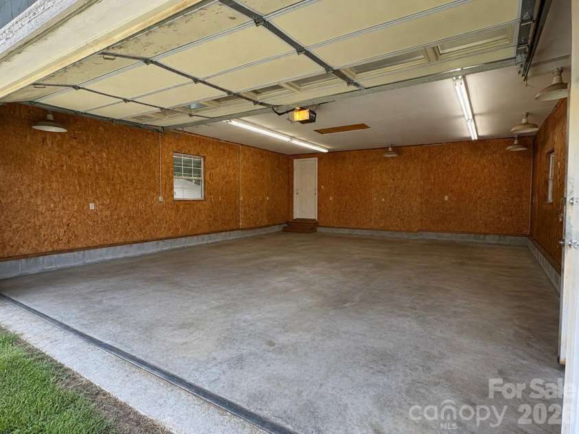 1001 Klondale Avenue, Kannapolis, NC 28081.  MLS# CAR4421747, YatesRealty ID 48909. Garage AI Generated