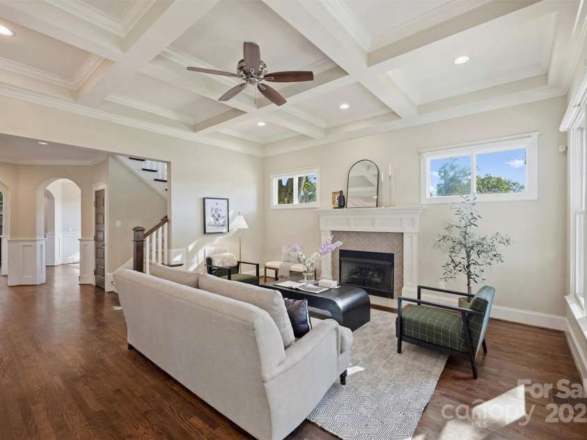 3304 Josephine Court, Charlotte, NC 28205.  MLS# CAR4319912, YatesRealty ID 48912. The Family Room features high coffered ceilings with recessed lighting, and gas logs fireplace with quartz hearth, subway tile surround, and handsome mantle.