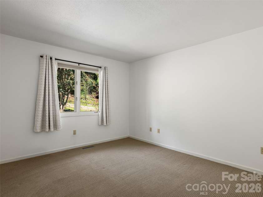 288 Roberts Drive, Laurel Park, NC 28739.  MLS# CAR4420800, YatesRealty ID 48914. Comfortable main-level guest room