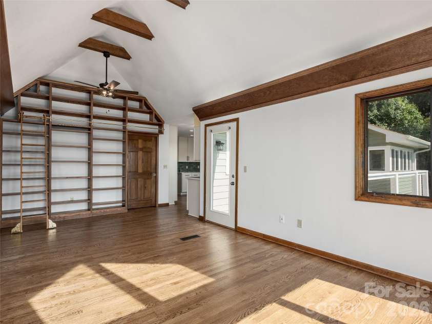288 Roberts Drive, Laurel Park, NC 28739.  MLS# CAR4420800, YatesRealty ID 48914. Dining room with floor to ceiling bookcase