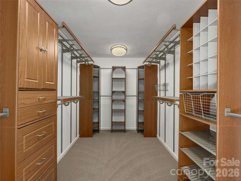 288 Roberts Drive, Laurel Park, NC 28739.  MLS# CAR4420800, YatesRealty ID 48914. Generous Primary closet with extensive built-in storage
