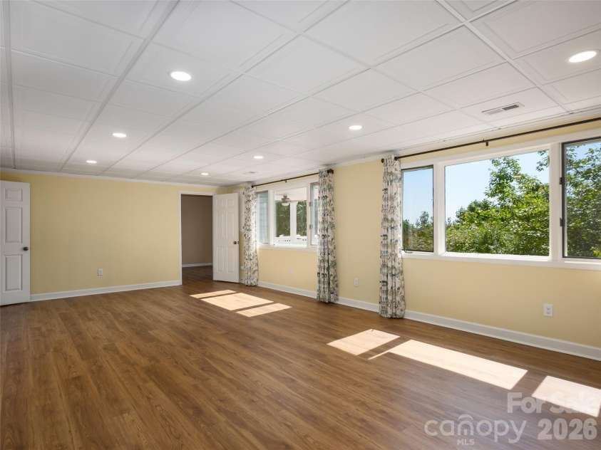 288 Roberts Drive, Laurel Park, NC 28739.  MLS# CAR4420800, YatesRealty ID 48914. Light filled Rec room