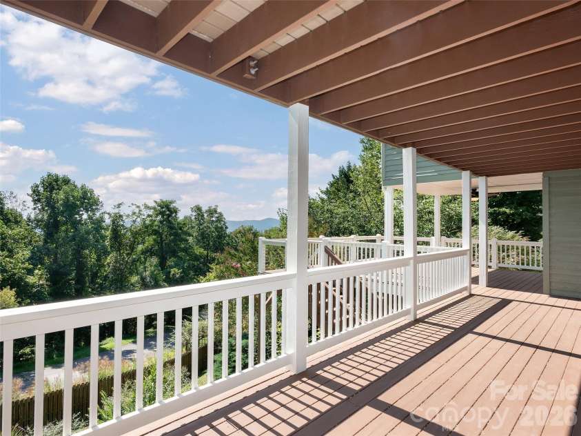 288 Roberts Drive, Laurel Park, NC 28739.  MLS# CAR4420800, YatesRealty ID 48914. Lower level deck with ample space for multiple seating or entertaining space