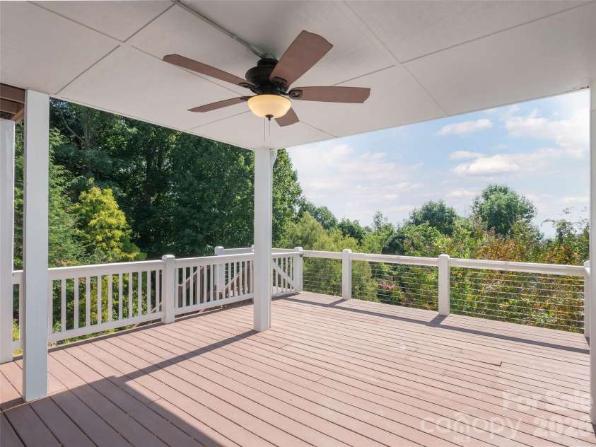 288 Roberts Drive, Laurel Park, NC 28739.  MLS# CAR4420800, YatesRealty ID 48914. Lower level deck with overhang for those sunny or rainy days