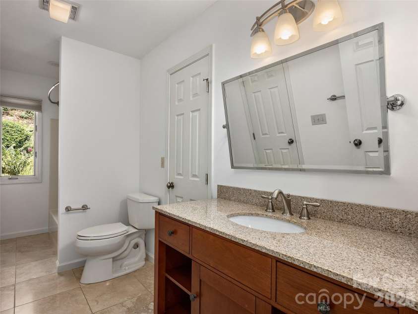 288 Roberts Drive, Laurel Park, NC 28739.  MLS# CAR4420800, YatesRealty ID 48914. Main-level bath with updated finishes