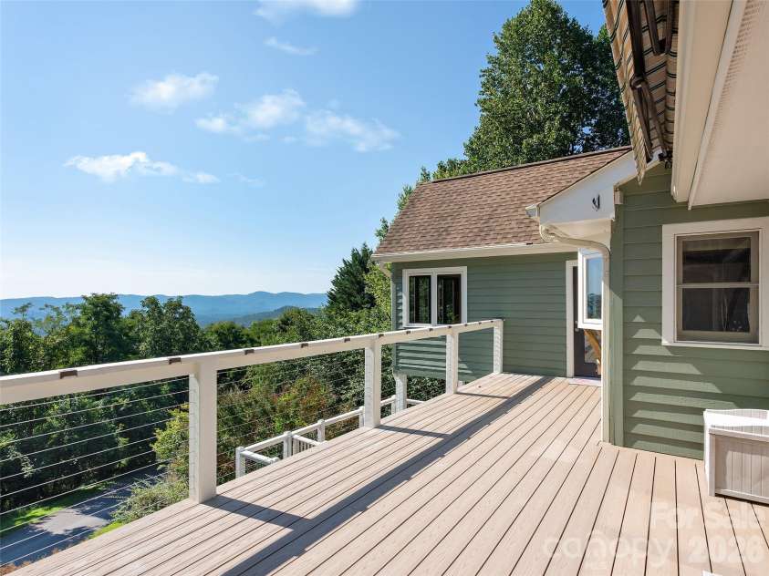 288 Roberts Drive, Laurel Park, NC 28739.  MLS# CAR4420800, YatesRealty ID 48914. Main level deck with Azek decking and remotely controlled awning
