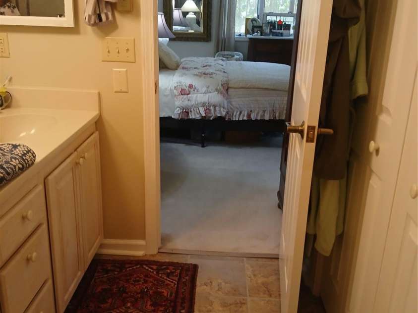 304 red oak Drive, Hendersonville, NC 28791.  MLS# CAR4420508, YatesRealty ID 48919. View from primary bath to bdrm.