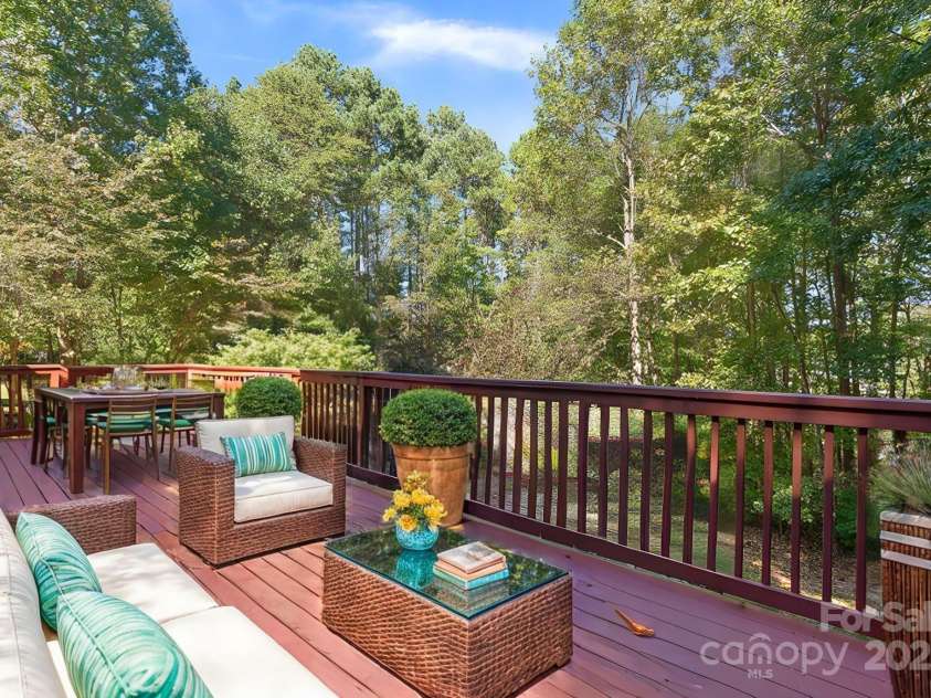 128 Archbell Point Lane, Mooresville, NC 28117.  MLS# CAR4192948, YatesRealty ID 4892. Back Porch with staged furniture