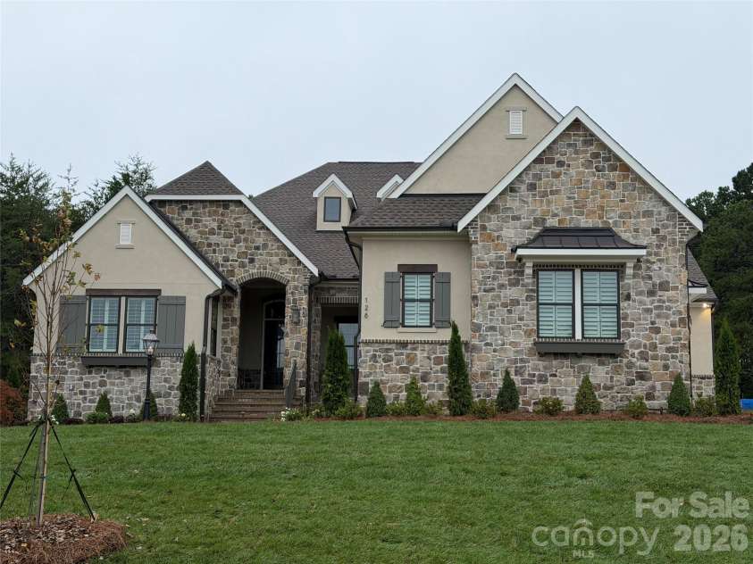 128 Willow View Loop, Davidson, NC 28036.  MLS# CAR4403823, YatesRealty ID 48929. Beautiful French Cottage exterior