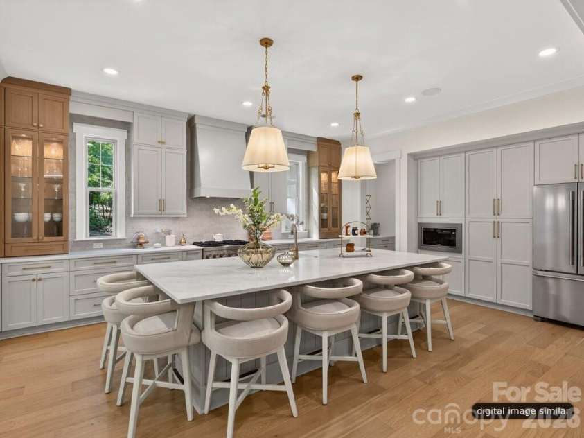 128 Willow View Loop, Davidson, NC 28036.  MLS# CAR4403823, YatesRealty ID 48929. Oversized Luxury Kitchen Island that seats 6