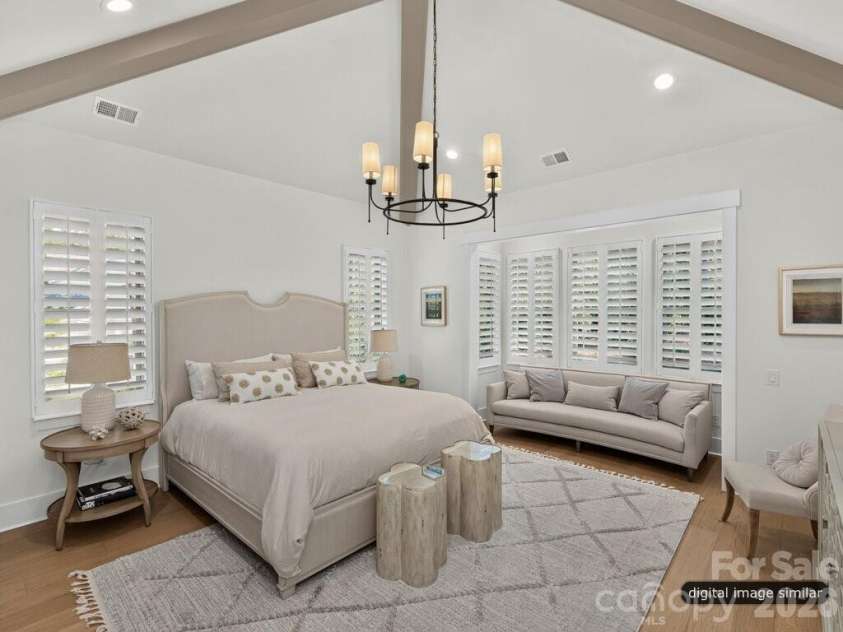 128 Willow View Loop, Davidson, NC 28036.  MLS# CAR4403823, YatesRealty ID 48929. Primary Bedroom with Soaring Ceiling Height and Beams