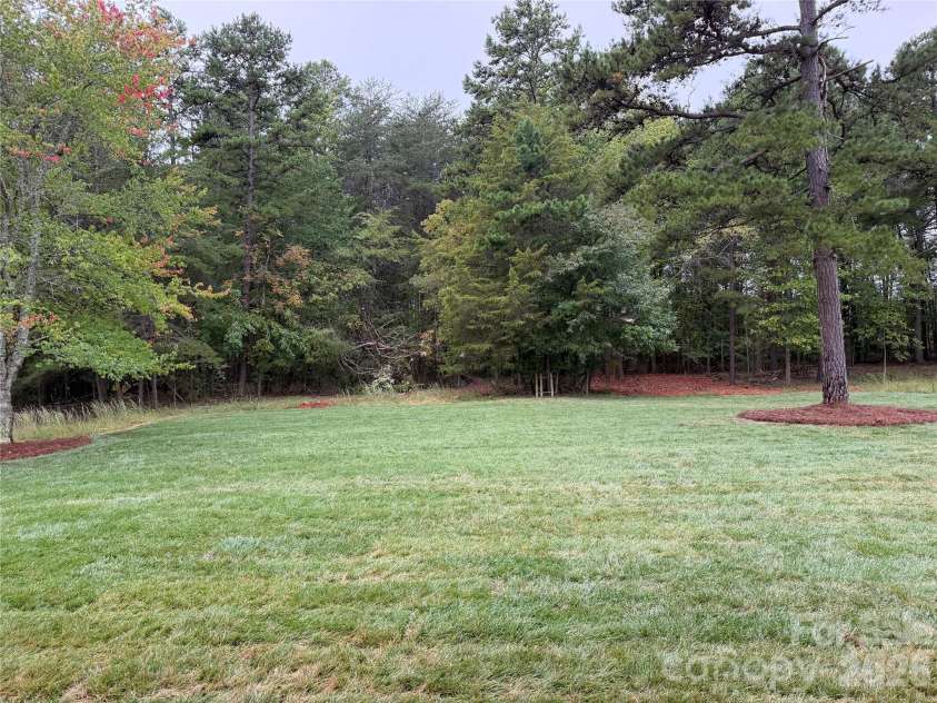 128 Willow View Loop, Davidson, NC 28036.  MLS# CAR4403823, YatesRealty ID 48929. Spacious backyard perfect for a pool!