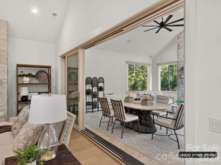 128 Willow View Loop, Davidson, NC 28036.  MLS# CAR4403823, YatesRealty ID 48929. Stacking Doors flow to Covered Outdoor Terrace