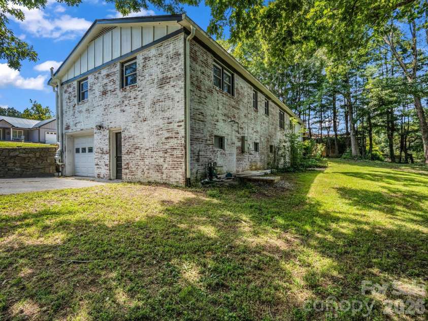 3208 Florida Drive, Hendersonville, NC 28792.  MLS# CAR4420340, YatesRealty ID 48937. Basement garage door